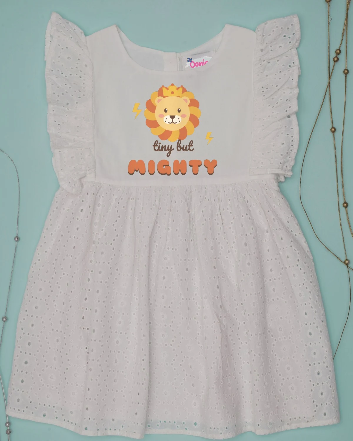 Baby Dress with the "Tiny but mighty." design