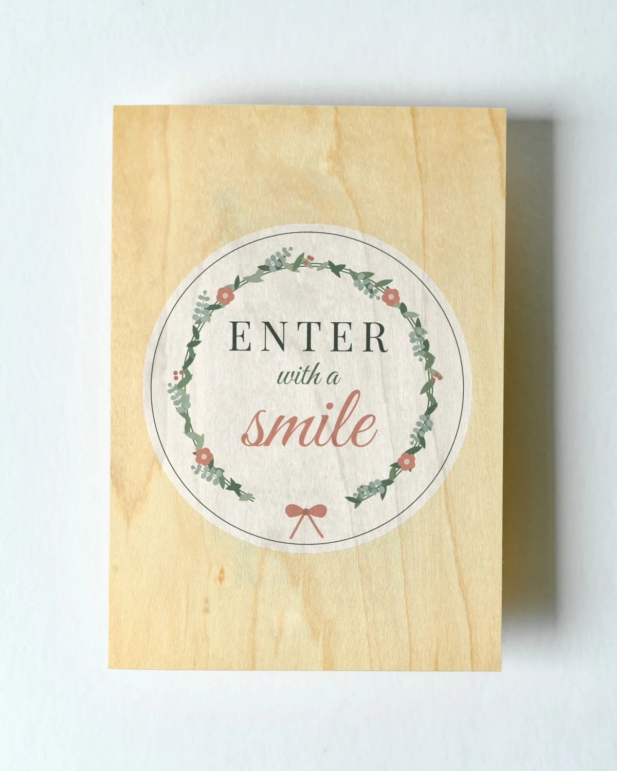 Door Sign with the "Enter with a smile." design