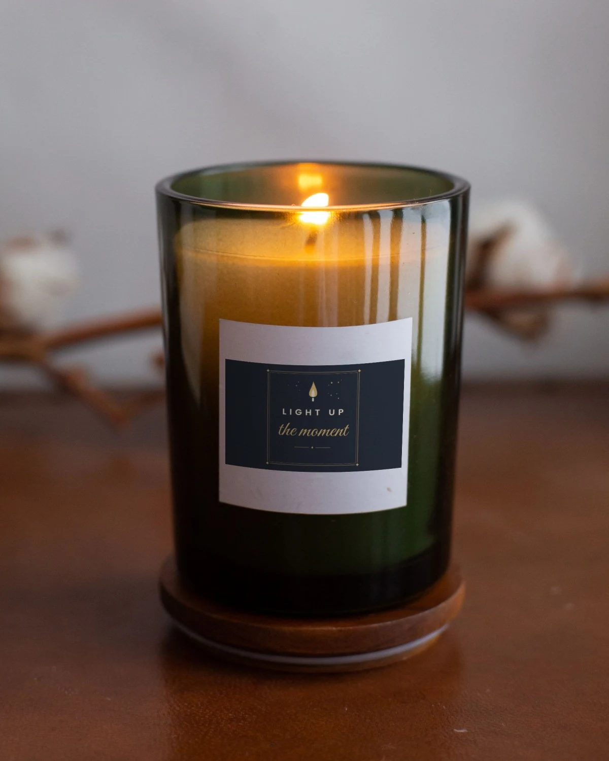 Candle with the "Light up the moment." design