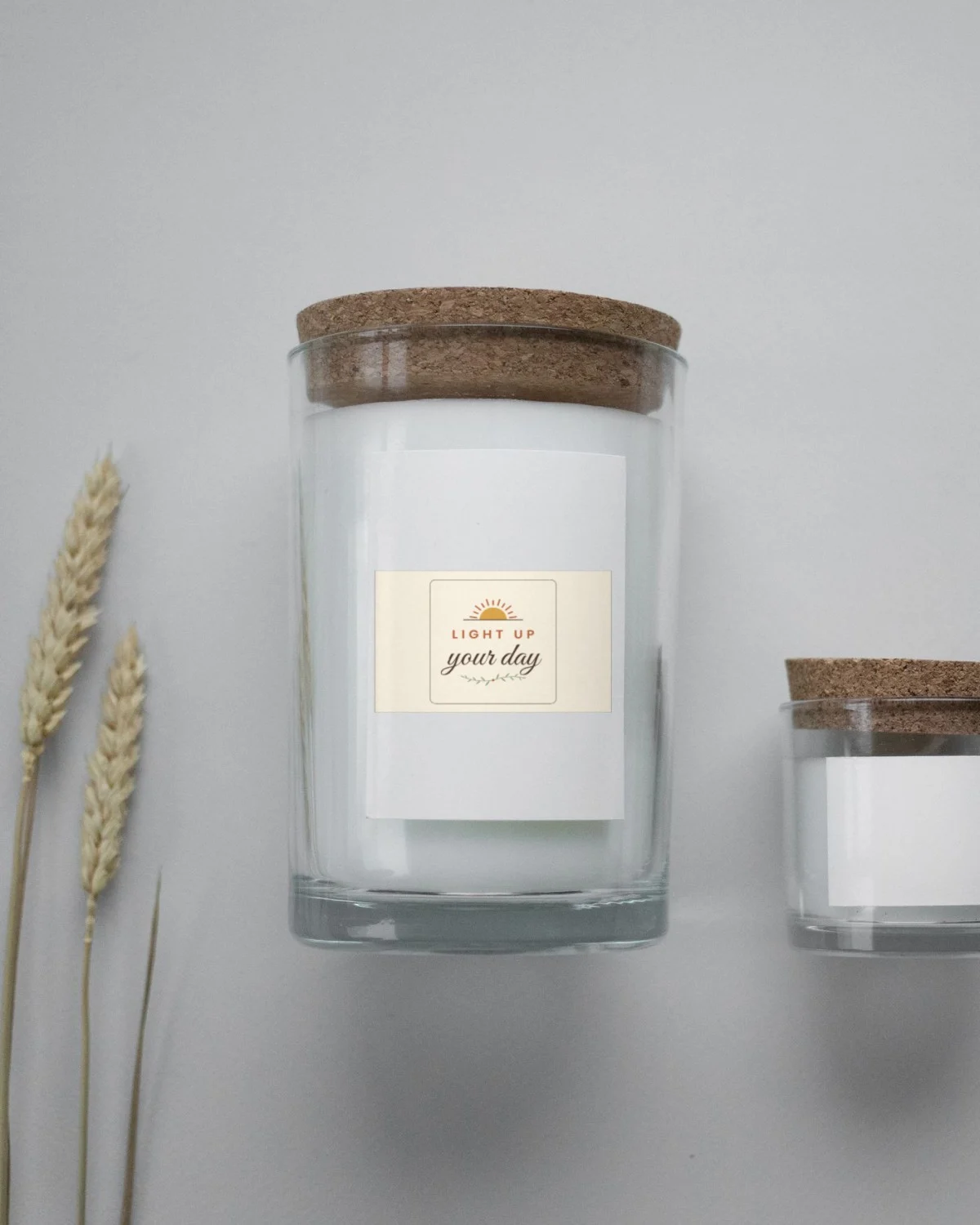 Candle with the "Light up your day." design