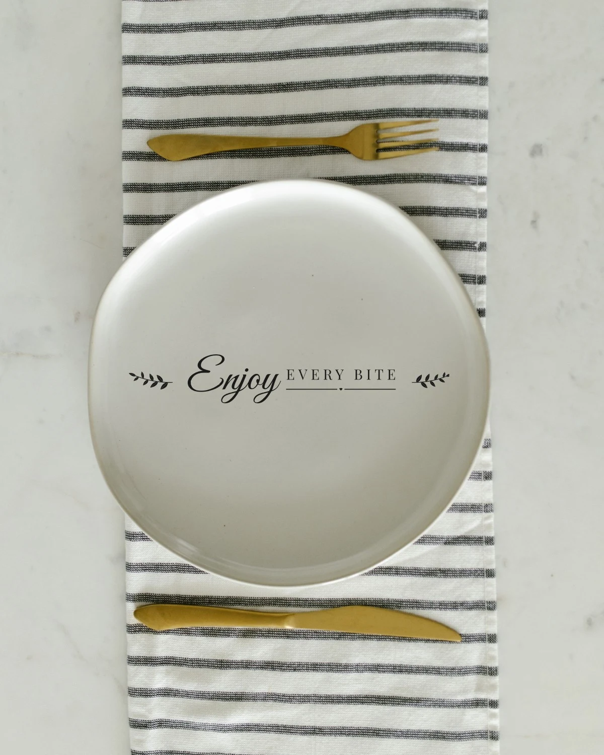Spoon with the "Enjoy every bite." design