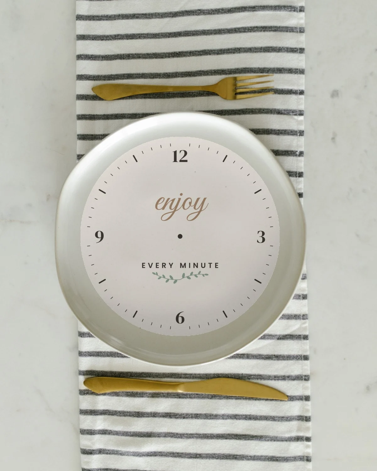Clock with the "Enjoy every minute." design