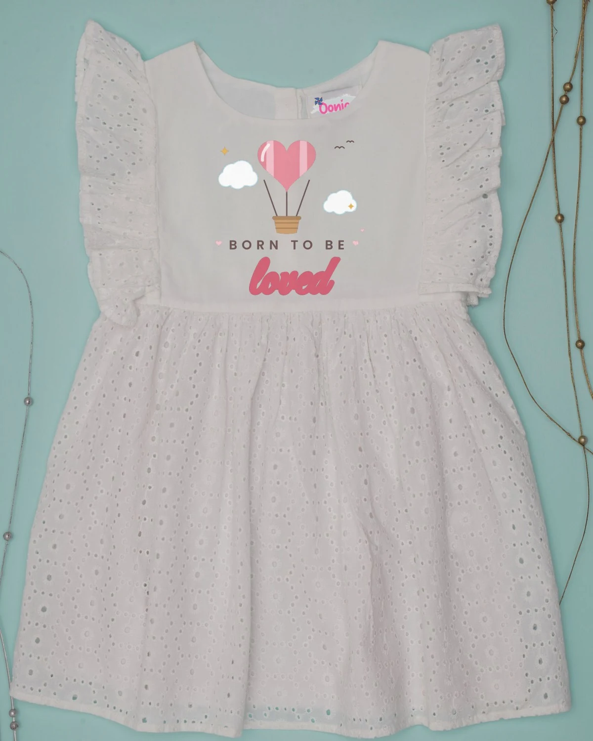 Baby Dress with the "Born to be loved." design