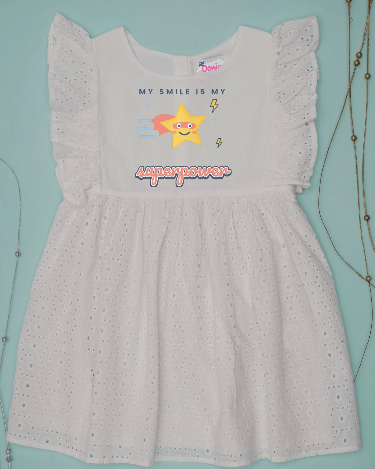 Baby Dress with the "My smile is my superpower." design