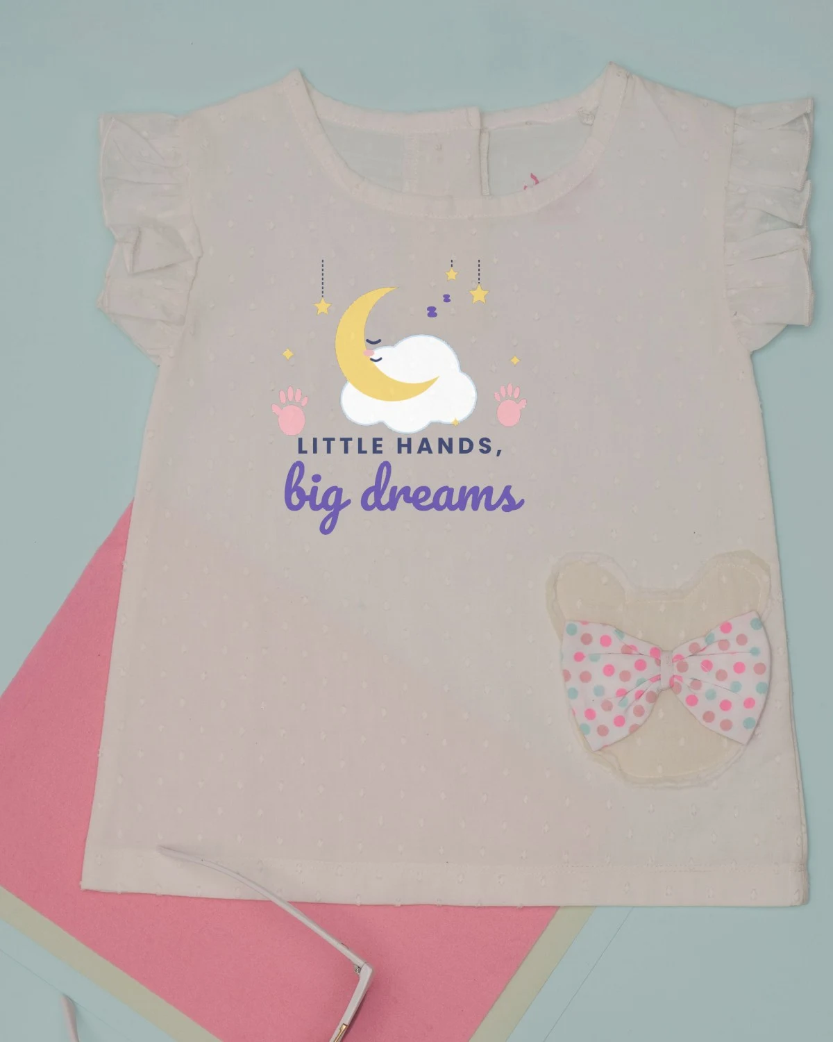 Baby Dress with the "Little hands, big dreams." design