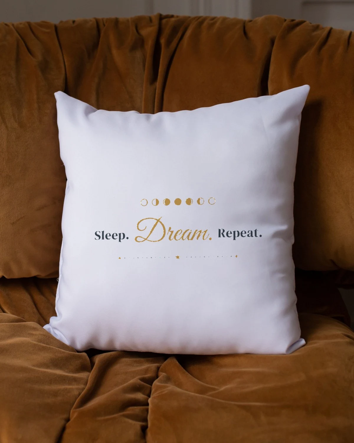 Pillow with the "Sleep. Dream. Repeat." design