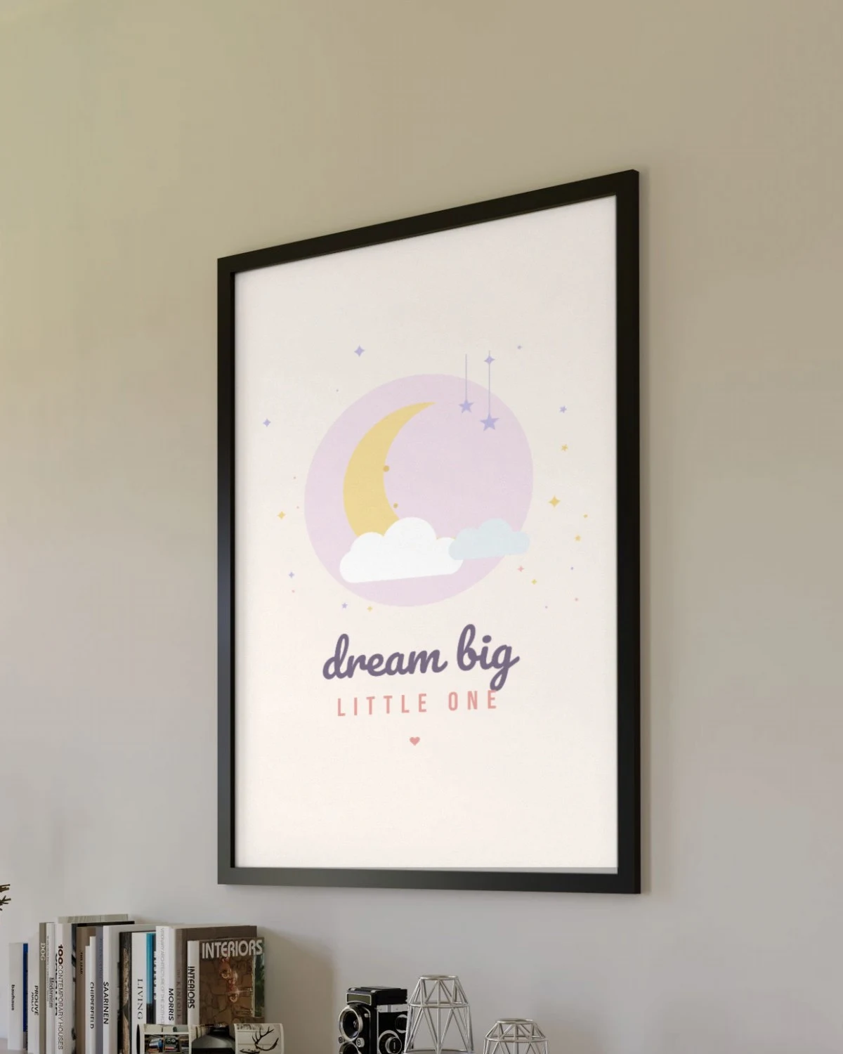 Dream Big Little One Nursery Print framed on a living room wall