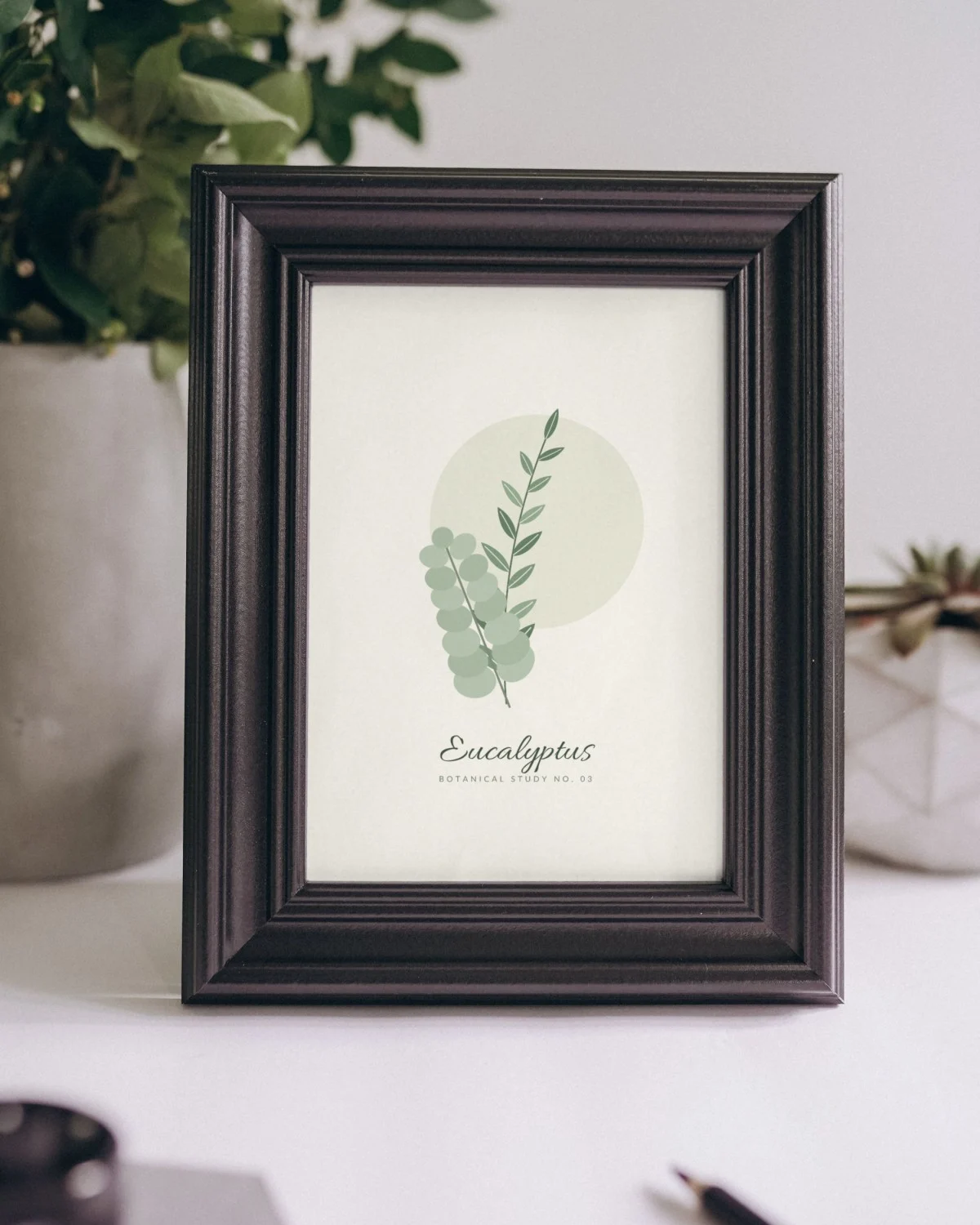 Sage Green Botanical Print framed on a shelf