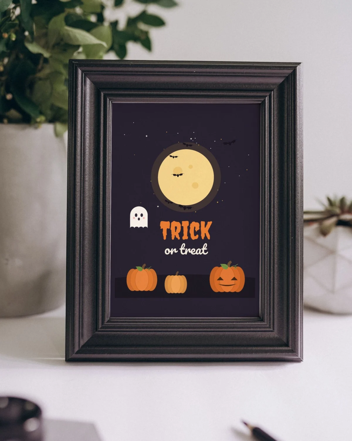 Trick or Treat Sign Printable framed on a shelf