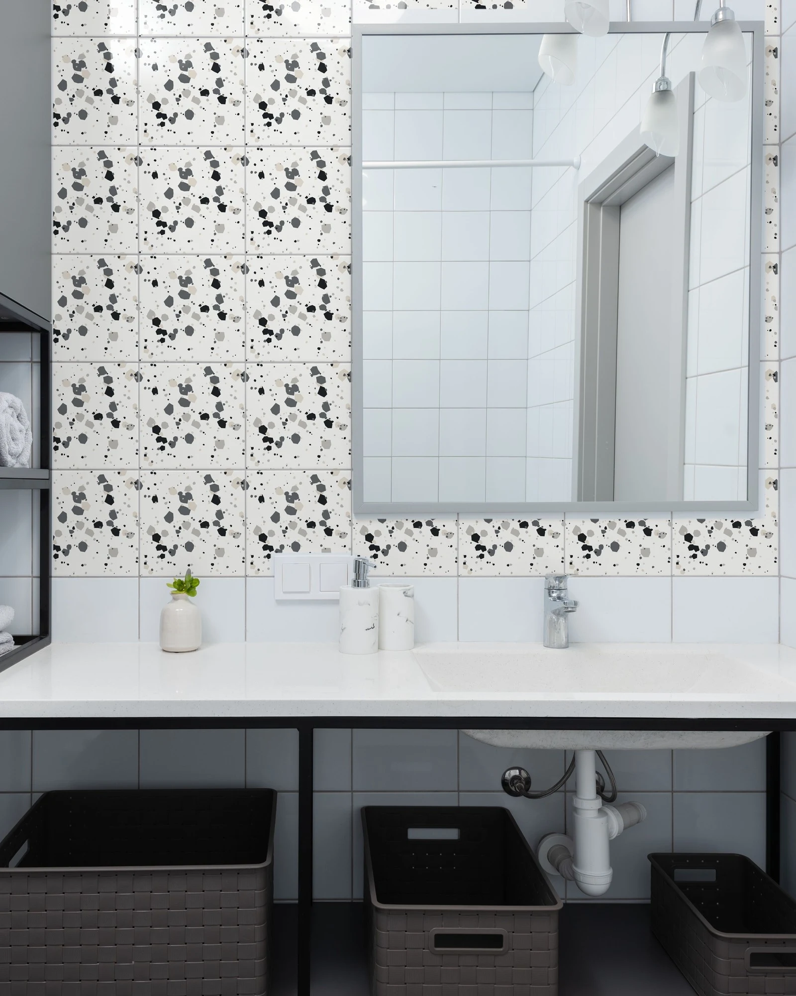 Terrazzo Classic Grey tiles as a bathroom backsplash above a vanity