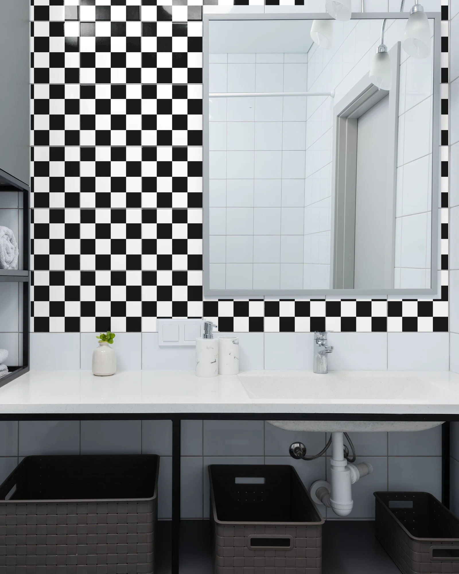 Classic Black and White tiles as a bathroom backsplash above a vanity
